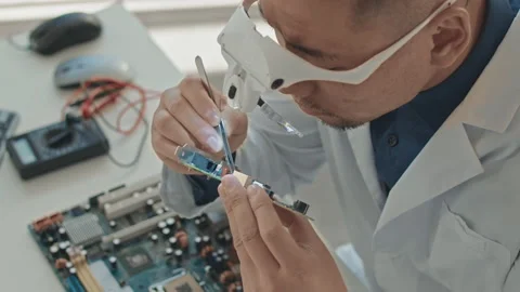 Electronics Engineer Assembling Motherboard Video stock 195333098