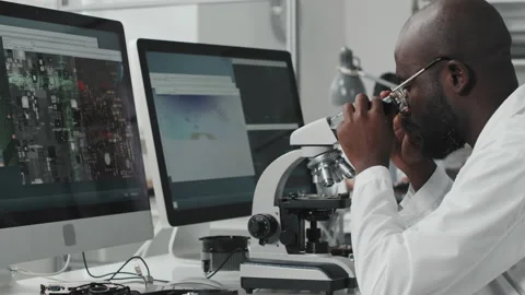 Electronics Engineer Examining Computer Chip with Microscope Video stock 170115752