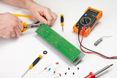 Electronics engineer fixing a socket to a printed circuit board Stock Photos