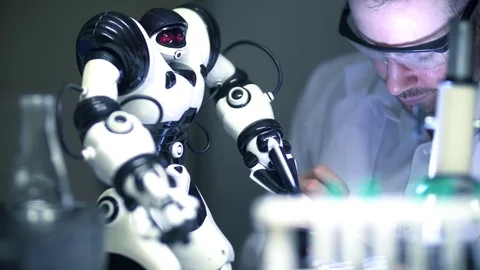 Electronics Engineer Inventor Testing the Product Design of a Robot in Lab Stock Footage 77960162