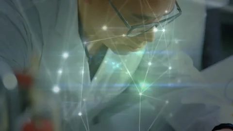 Electronics engineer probing and soldering PCB as network overlay highlights Stock Footage 327786348