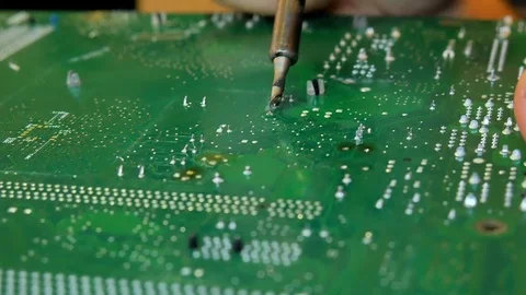 Electronics Engineer is Soldering an Electric Board repair computer. Video stock 81670798