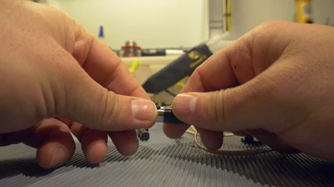Electronics engineer testing and repairing electronic cables in his workshop - a Stock Footage 104810362
