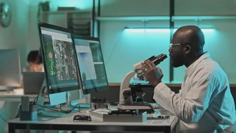 Electronics Engineer Using Microscope Connected to Computer in Lab Video stock 170117776