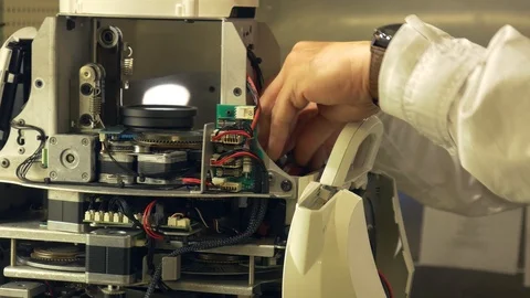 Electronics engineer working on repairing LED Nightclub Moving Head Light Stock Footage 106324453