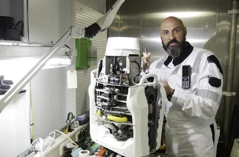 Electronics Engineer Works with on Robot. Computer Science Research Laboratory Stock Photos