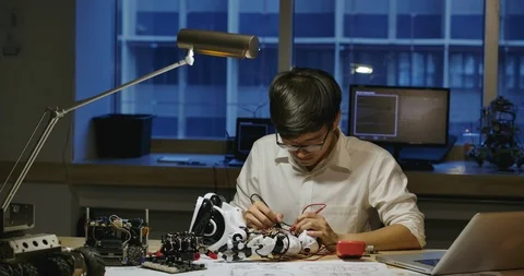 Electronics engineers work with robot in laboratory. Stock Footage 111839860