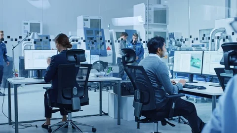 Electronics Factory Male Electrical Engineer Holds PCB Prototype, Works on PC Stock Footage 124307171