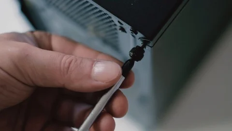 Electronics fix, hand with screwdriver Stock Footage 96107346