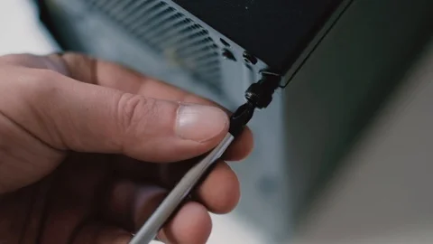 Electronics fix, hand with screwdriver Stock Footage 96107375