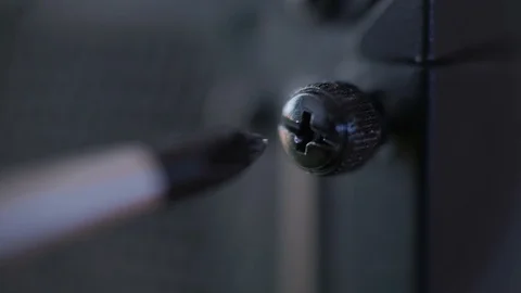 Electronics fix, hand with screwdriver Stock Footage 96107411