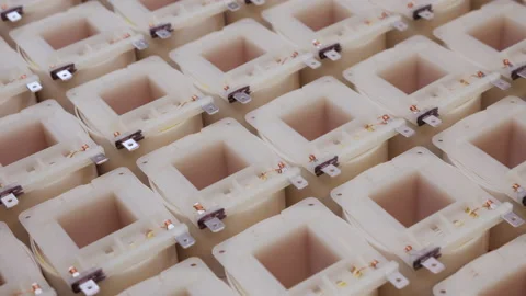 Electronics industry - camera slide over many transformer coils Stock Footage 139743471