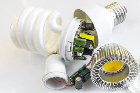 Electronics LED GU10 vs CFL E27 Stock Photos