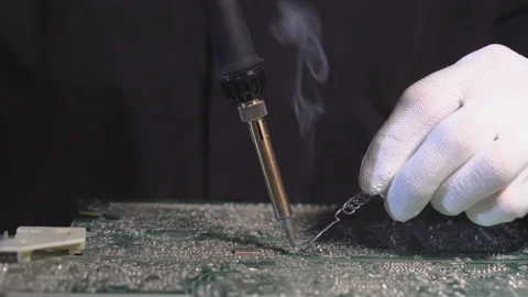 Electronics Maintenance Engineer Soldering Motherboard, Microchip and Circuit Stock Footage 112559029