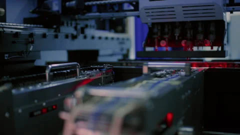 Electronics manufacturing. Components on a circuit board, transistors, and chips Stock Footage 348227237