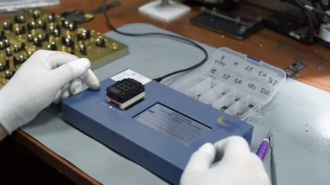 Electronics repair. Master repairs bad gadgets, smartphones. Stock Footage 73797248