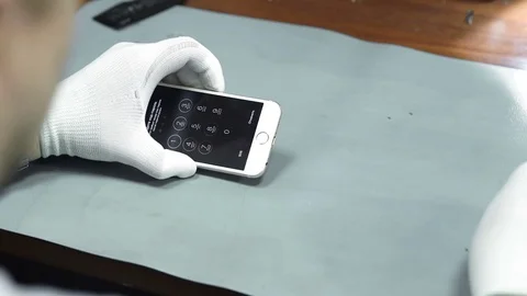 Electronics repair. Master repairs bad gadgets, smartphones. Stock Footage 73799094