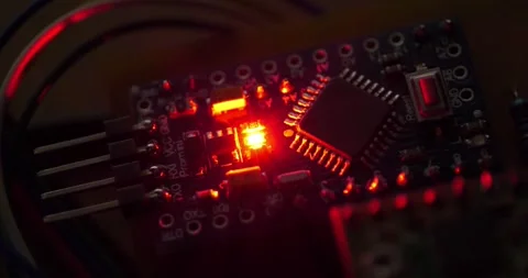 Electronics repair. Small electronic circuit with burning red LED light bulb Stock Footage 276921583