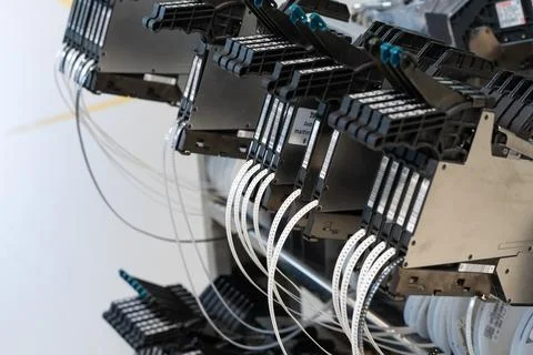 Electronics SMT reel components and feeders on the assembly line Stock Photos