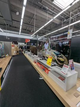 Electronics store display showcasing tvs and boxes in retail interior with .. 写真素材