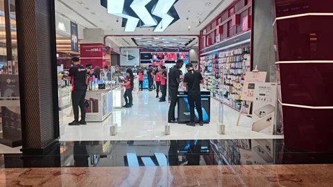 Electronics store E max with a red and white logo, showcases various gadgets. 스톡 동영상 311589487