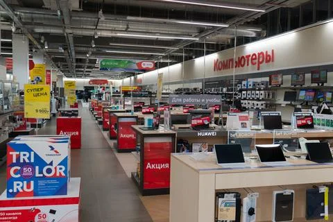 Electronics store interior with computers and laptops on display, Russia. Stock Photos
