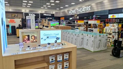 Electronics store interior with displays and product boxes Stock Photos