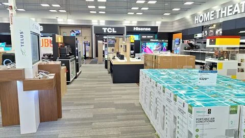Electronics store interior with portable air conditioners on display. Stock Photos