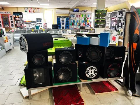 Electronics store showcasing subwoofer speakers and audio equipment for sale Stock Photos