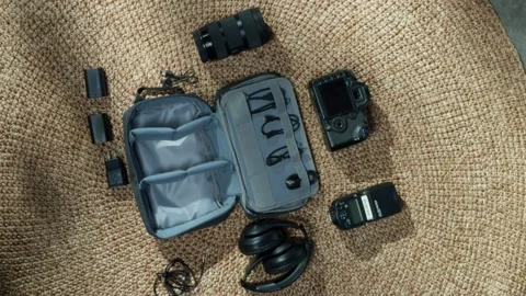Electronics Surrounding a Bag, Workspace or Travel Tech Setup Concept Stock Footage 311706055