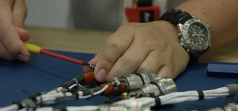 Electronics technician soldering cable Stock Footage 90535292