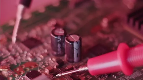 Electronics Technician Testing PCB Components with Multimeter Probe near Ca.. Stock-Footage 335145562