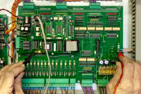 Electronics test engineer testing a digital circuit board Stock Photos