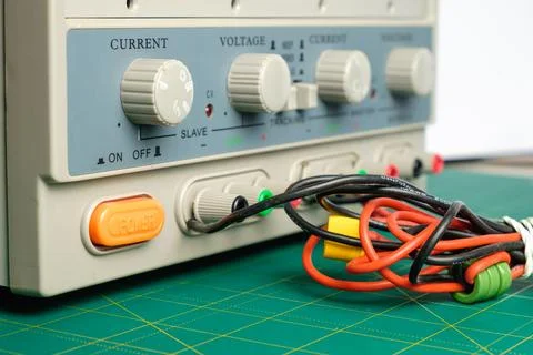 Electronics testing device with colorful cables on a workspace Stock Photos