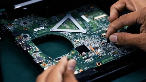 Electronics Worker Assembling Components on a Printed Circuit Board Stock Footage 90976276