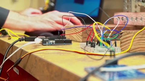 Electronics Workshop Close-Up with Components and Hand Stock Footage 325759764
