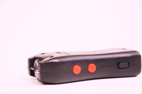 An Electroshocker on a white background. Self-defense tool. Stock Photos