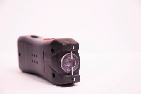 An Electroshocker on a white background. Self-defense tool. Stock Photos
