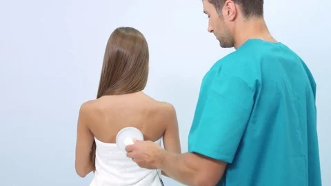 Electrostatic massage on patient's back Stock Footage