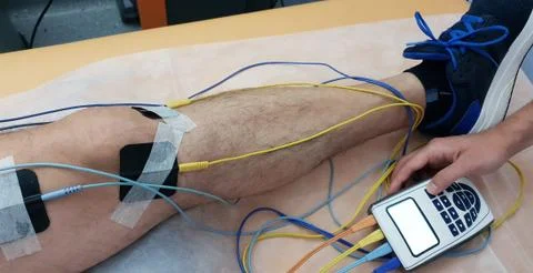 Electrostimulation of the quadriceps as a physiotherapy therapy Stock Photos