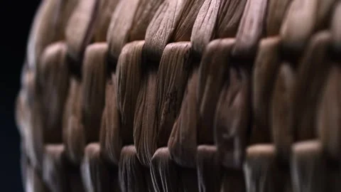 The elegance of a handmade, dark brown wicker basket is showcased as it spi.. Stock Footage 264765971