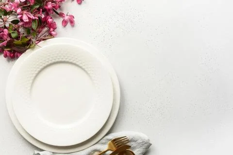 Elegance table setting decorated apple tree flowers, golden cutlery Stock Photos
