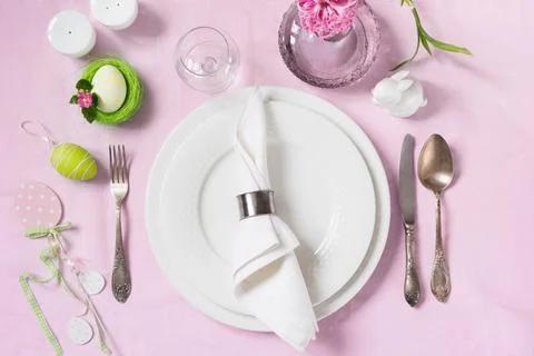 Elegance table setting spring pink flowers. Easter dinner. Stock Photos