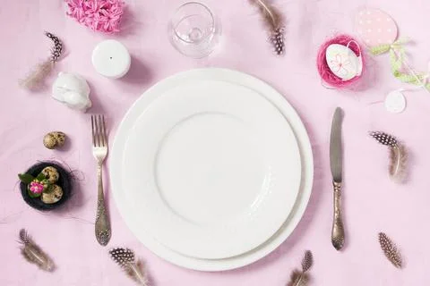 Elegance table setting spring pink flowers. Easter dinner. Stock Photos