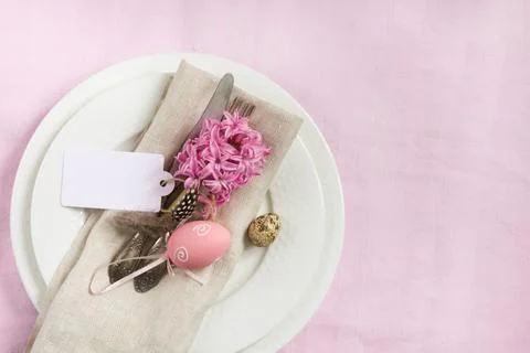 Elegance table setting spring pink flowers. Easter dinner. Stock Photos