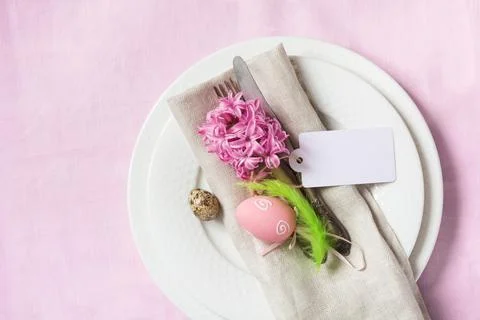 Elegance table setting spring pink flowers. Easter dinner. Stock Photos