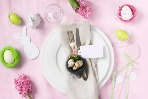 Elegance table setting spring pink flowers. Easter dinner. Stock Photos