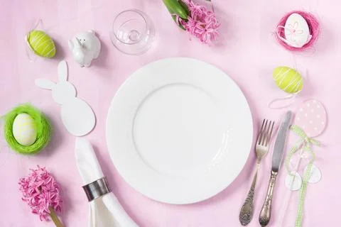 Elegance table setting spring pink flowers. Easter dinner. Stock Photos