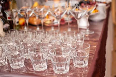 Elegant Array of Crystal Glassware on a Sweeping Table Setting for a Celebrat Stock Photos
