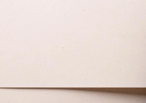 Elegant background with overlapping sheets of designer paper in beige and cre Stock Photos